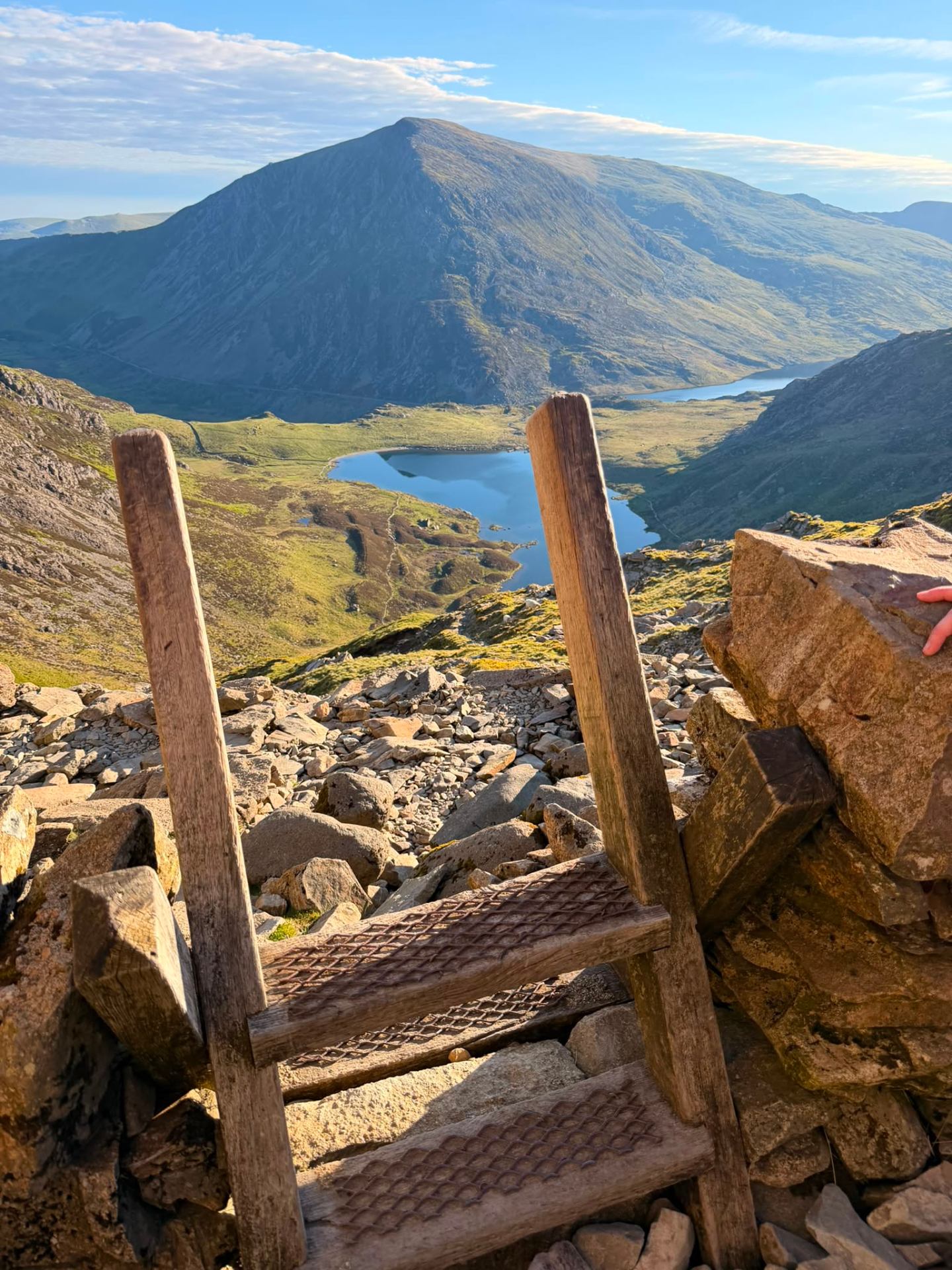 Hiking view across Eryri from a stone stile